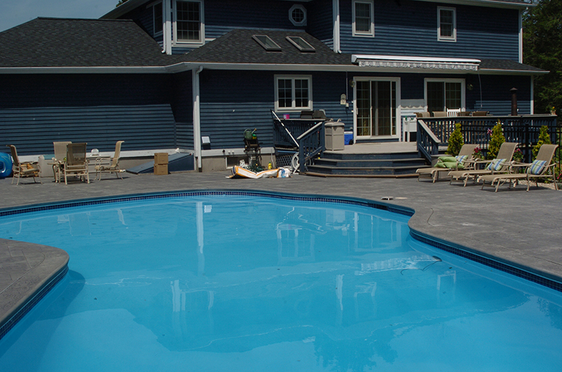 Swimming pool and stamped concrete project example 98